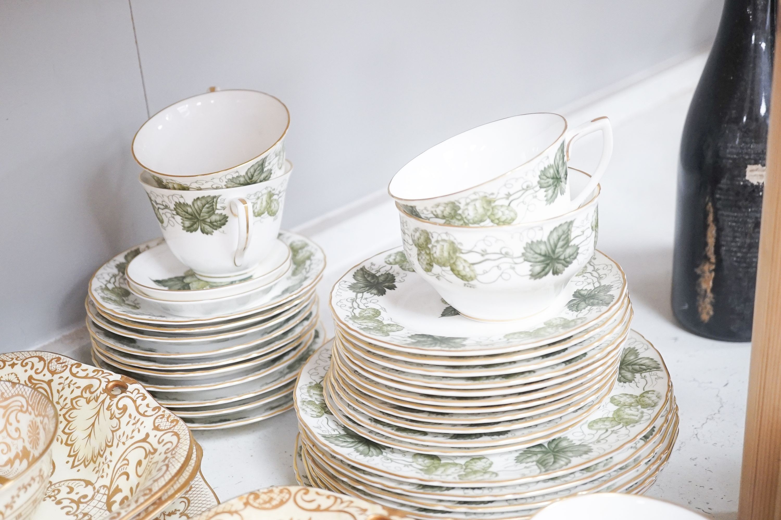 A Crown Staffordshire fifty nine piece part tea set and dessert service, central flowers and gilt borders, a Paragon part tea set and other ceramics